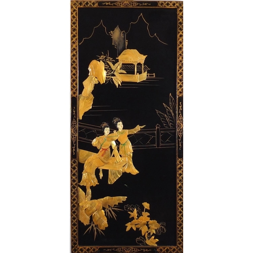 2224 - Chinese black lacquered and mother of pearl panel, decorated in relief with figures in a palace sett... 