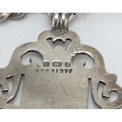 2360 - Silver vesta and sports jewel on a white metal chain, the vesta Birmingham hallmarked, approximate w... 