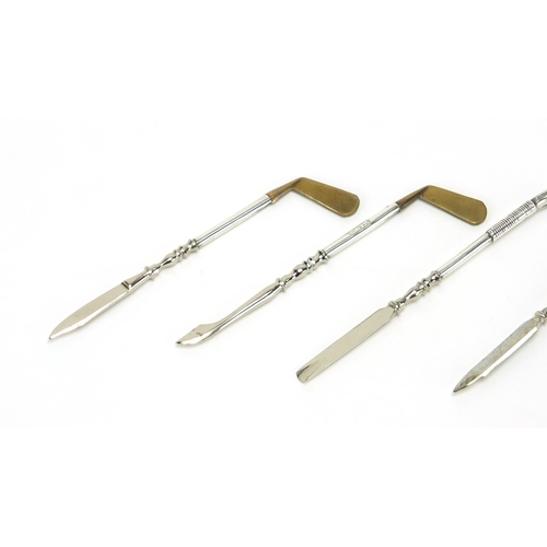2358 - Set of four novelty sterling silver golf club vanity tools, the largest 9cm in length,  approximate ... 