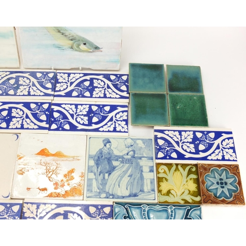 2217 - Collection of pottery tiles including a pair of Minton examples, hand painted with fish, each 20.5cm... 