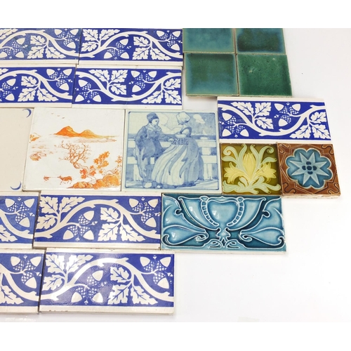 2217 - Collection of pottery tiles including a pair of Minton examples, hand painted with fish, each 20.5cm... 
