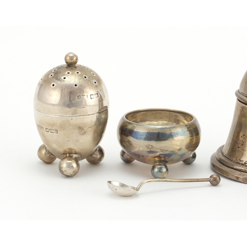 2349 - Silver items comprising bell shaped inkwell, a caster and open salt with ball feet, various hallmark... 
