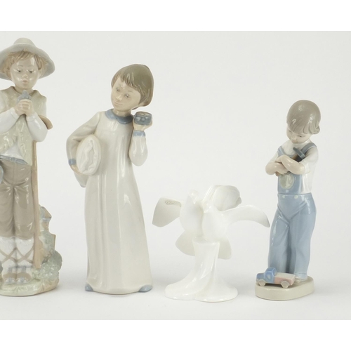 2090 - Four Lladro and Nao figures and two Royal Doulton Images doves, the largest28cm high