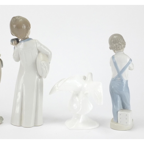 2090 - Four Lladro and Nao figures and two Royal Doulton Images doves, the largest28cm high