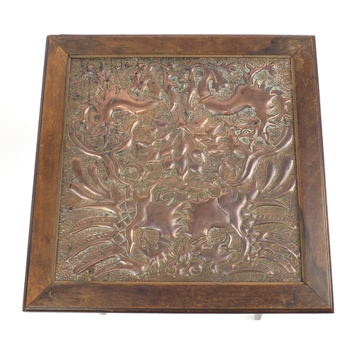 2050 - Oak Arts & Crafts centre table with inset copper panel embossed with stylised dragons, 62cm H x 45cm... 