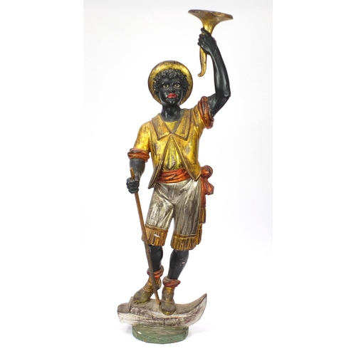 2003 - 19th century Venetian gesso and carved wood Blackamoor holding a torch aloft standing upon a gondola... 