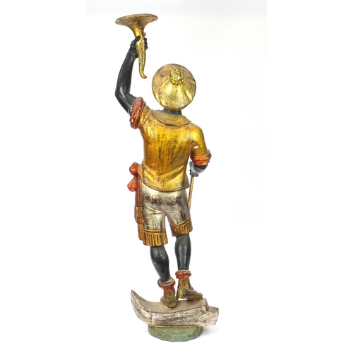 2003 - 19th century Venetian gesso and carved wood Blackamoor holding a torch aloft standing upon a gondola... 