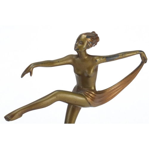 2099 - Art Deco bronzed figurine of a semi nude dancer raised on a marble base, 21cm high