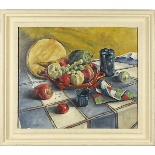 2227 - Still life fruit on a table, oil on canvas, bearing an inscription verso, framed, 52cm x 44cm