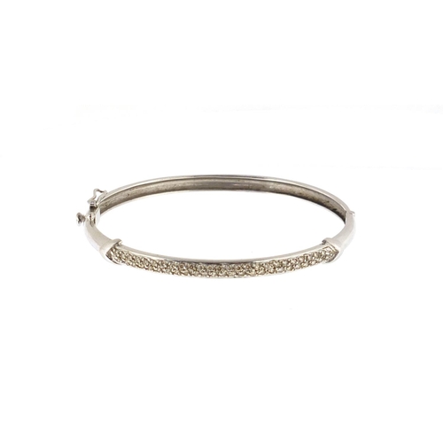 2431 - Unmarked white gold diamond bangle, approximate weight 13.6g