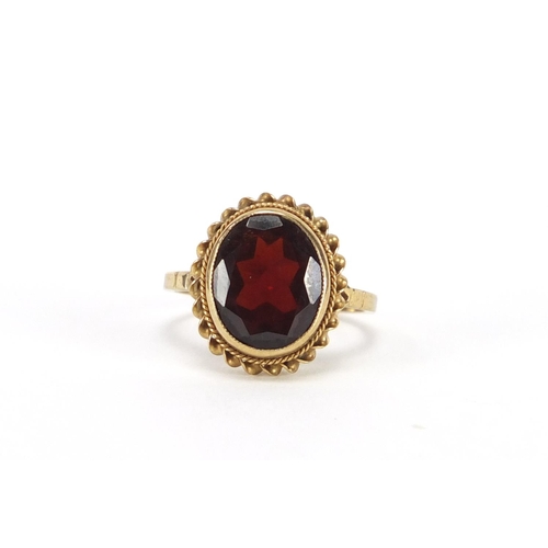 2446 - 9ct gold garnet solitaire ring, size L, approximate weight 3.3g