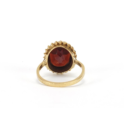 2446 - 9ct gold garnet solitaire ring, size L, approximate weight 3.3g
