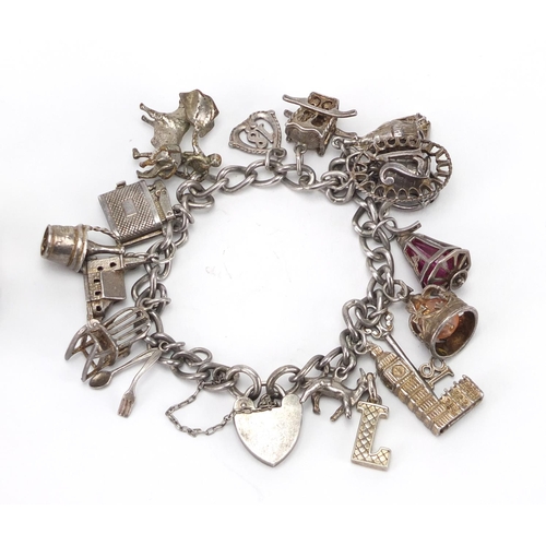 2437 - Silver charm bracelet with a selection of mostly silver charms and a silver gate bracelet, approxima... 