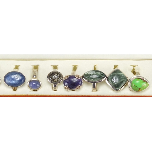 2475 - Twelve silver semi precious stone rings, housed in a display box, various sizes, approximate weight ... 