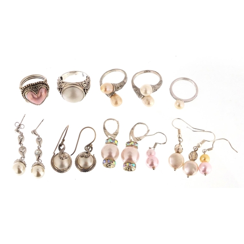 2440 - Silver and pearl jewellery comprising five rings and five pairs of earrings, approximate weight 48.6... 