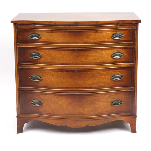 2002 - Good quality reproduction mahogany serpentine chest with yew wood banding and brushing slide above f... 