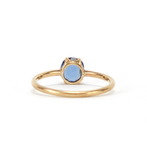 2463 - Unmarked gold blue stone solitaire ring, size O, approximate weight 1.7g