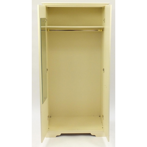 64A - Cream painted wood two door wardrobe, 195cm H x 95cm W x 65cm D