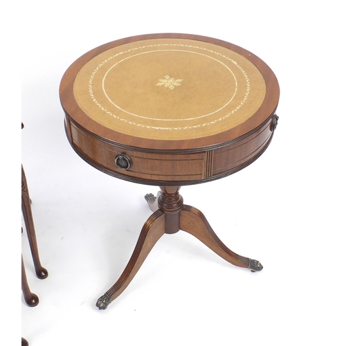 184 - Reproduction circular mahogany drum table with leather top and nest of three mahogany tables, the dr... 