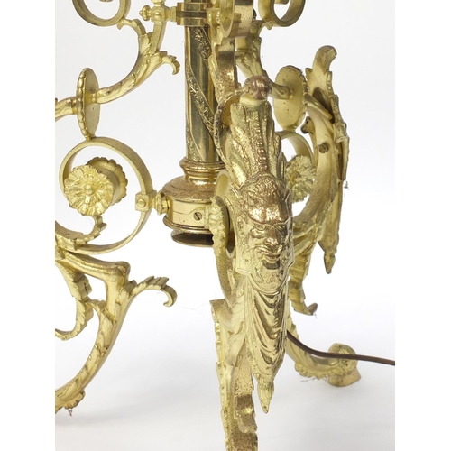 182A - Ornate brass standard lamp with onyx drinks tray, grotesques heads and hoof feet, 145cm high