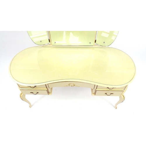 39 - French style cream and gilt kidney shaped dressing table with triple mirror and five drawers, 139.5c... 