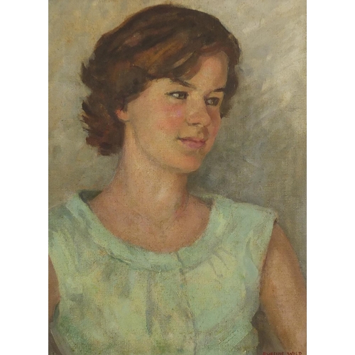 910 - Winifred Eveline Wild - Portrait of a girl in a green dress, signed oil on canvas board, mounted and... 