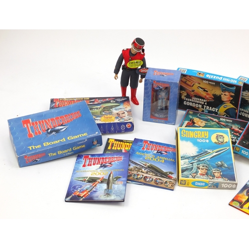 538 - Captain Scarlett and Thunderbird toys including jigsaw puzzles and action figure