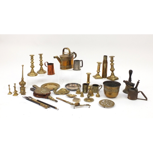 518 - Metalwares including Victorian and later brass candle sticks, fire bellows and brass watering can