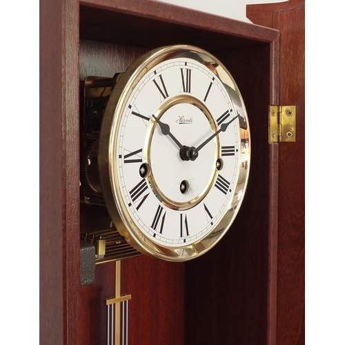 285 - Mahogany cased Hermle Westminster chiming wall hanging clock, 66cm in length