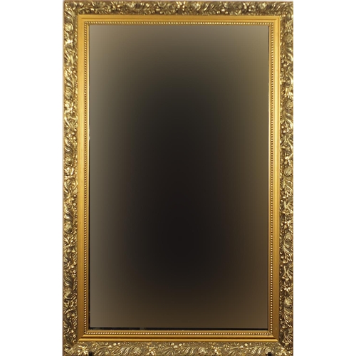 136 - Rectangular gilt framed mirror with bevelled glass, 87cm x 56cm