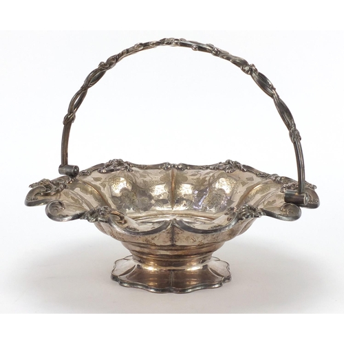 334 - Silver plated fruit basket with swing handle and engraved with vines, 30cm in diameter