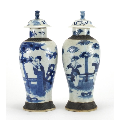 242 - Pair of Chinese blue and white crackle glazed baluster vases and covers, hand painted with figures, ... 