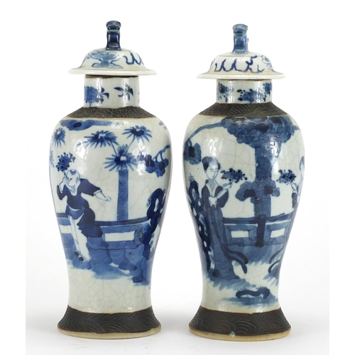 242 - Pair of Chinese blue and white crackle glazed baluster vases and covers, hand painted with figures, ... 