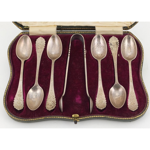 566 - Set of six silver sugar tongs and teaspoons, by Elkington & Co Birmingham 1909, housed in a tooled l... 