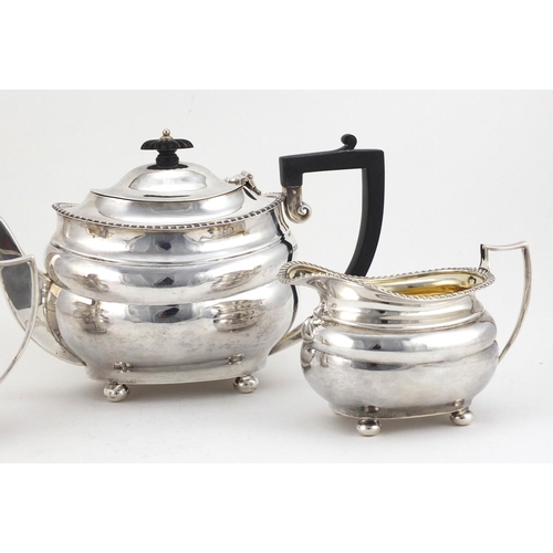 525 - Silver three piece tea set, by Josiah Williams & Co London 1928 and 1931, the teapot 15.5cm high, ap... 