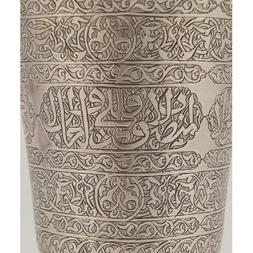 377 - Islamic silver chalice profusely engraved with script, impressed marks to the base, 12cm high, appro... 