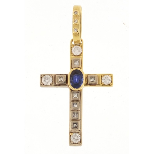 597 - 18ct gold diamond and blue stone cross pendant, 6cm in length, approximate weight 15.5g