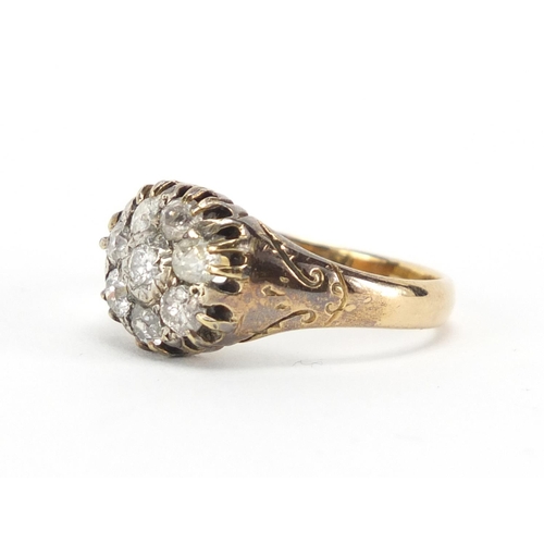 603 - 18ct gold diamond flower head ring, with engraved shoulders, size U, approximate weight 7.0g