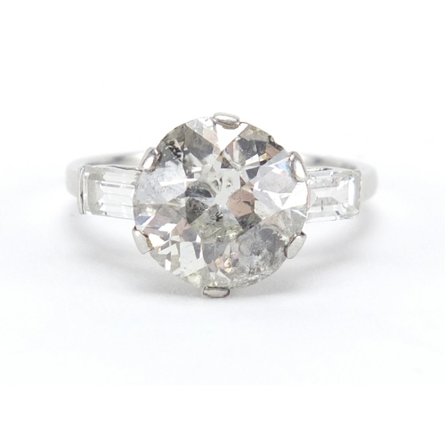 580 - Platinum diamond solitaire ring (approximately 3.00ct) with diamond shoulders , size O, approximate ... 
