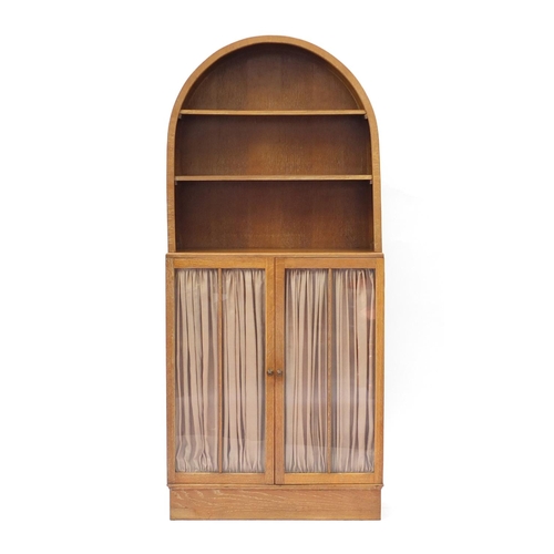 2124 - Limed oak dome topped dresser with open plate rack above a pair of glazed doors enclosing three adju... 