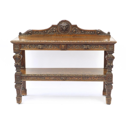 2106 - Oak two tier buffet with lion mask and leaf carvings, 112cm H x 137cm W x 45cm D