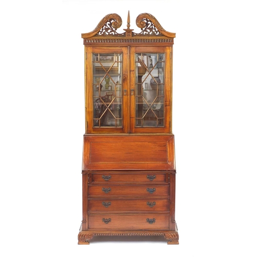 2022 - Mahogany bureau bookcase with a pair of astragal glazed doors, above a fall and four drawers on carv... 