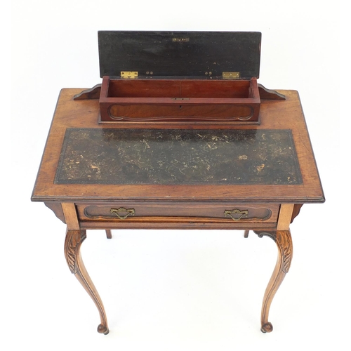 2123 - Edwardian mahogany escritoire, the top with pen box and tooled leather top above a drawer on carved ... 