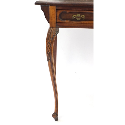 2123 - Edwardian mahogany escritoire, the top with pen box and tooled leather top above a drawer on carved ... 