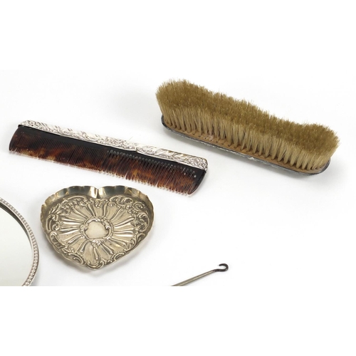 2549 - Six silver vanity items including hand mirror, brushes and heart shaped pin dish, various hallmarks,... 