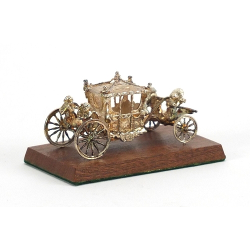 2528 - Miniature silver Coronation coach by Toye, Kenning & Spencer Ltd, with fitted box, 7cm in length