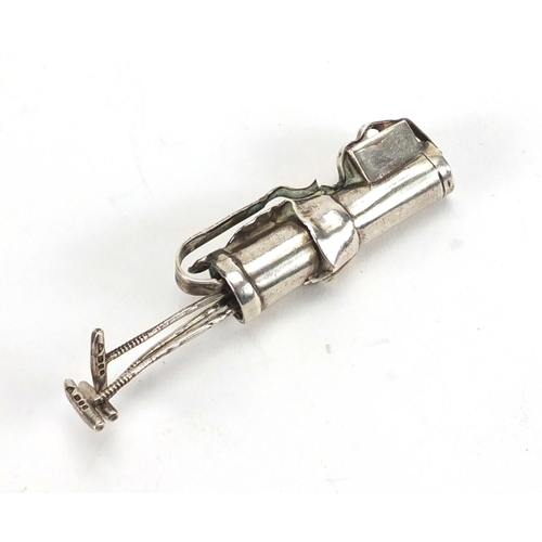 2533 - Novelty miniature silver caddy with three clubs, A M London 1970, 6.5cm in length, approximate weigh... 