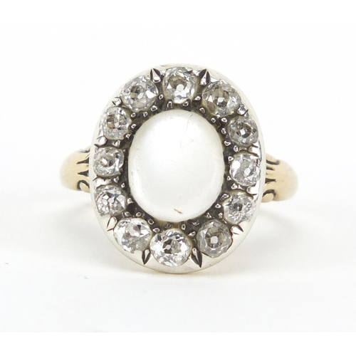 593 - Victorian unmarked gold moonstone and diamond ring, size K, approximate weight 4.5g