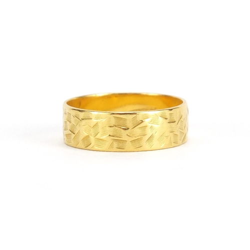 2642 - 22ct gold wedding band with engraved decoration, size M, approximate weight 3.6g