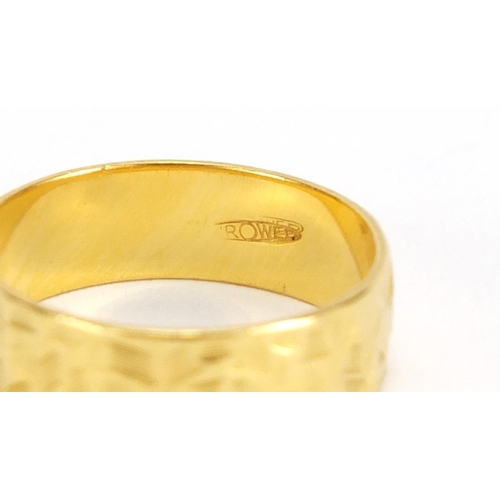 2642 - 22ct gold wedding band with engraved decoration, size M, approximate weight 3.6g